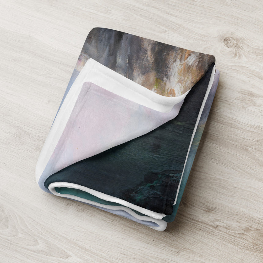 The Pillars Of Kings - Blanket in dark green fantasy art landscape print, folded on pale wood