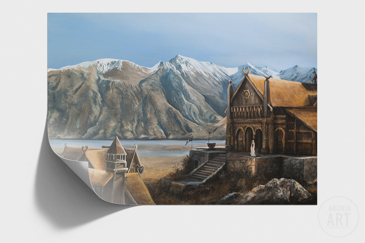 The Golden Hall - (Print) depicts a detailed fantasy landscape with a grand wooden hall in the foreground, snow-capped mountains in the background, and serene natural surroundings in a hand-painted style.
