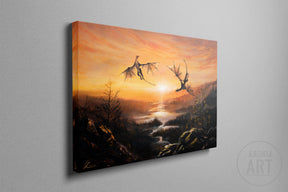Dance Of The Dragons (Print) features a dramatic fantasy scene with two dragons soaring over a rugged landscape illuminated by a glowing sunset, showcasing detailed hand-painted art.