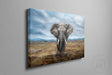 Elephant (Print) is a detailed fine art print depicting a majestic elephant standing in a vast, natural landscape under a dramatic cloudy sky.