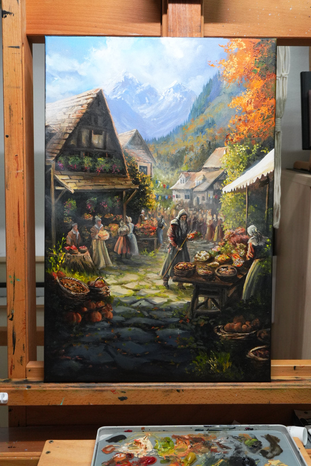 SORCERY Gothic Original Painting "Harvest Festival" - 60x40cm / Acrylics depicting a detailed medieval village market scene with villagers, autumn foliage, and mountain landscape, hand-painted by a traditional fantasy artist, blending fantasy art and gaming art with nostalgic nature elements. Fantasy and gaming art inspired by Lord of the Rings, Sorcery TCG, and nature.