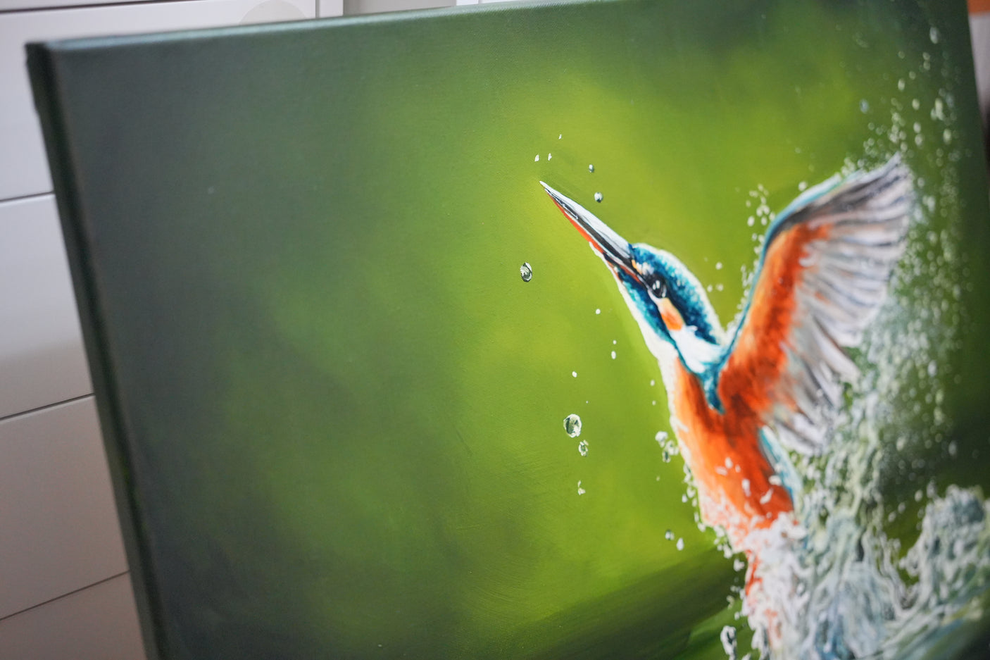 Wings Of Water - Original Oil Painting depicts a vibrant kingfisher emerging from water with detailed splashes, showcasing the skill of a fantasy artist in traditional oil paintings.