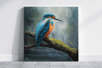 Kingfisher - (Print) features a hand-painted traditional fine art depiction of a vibrant blue and orange kingfisher perched on a mossy branch over a misty woodland background, blending acrylic and oil painting techniques with fantasy artist detail.