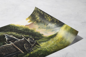 The Road Goes On (Print) showing a hand-painted fantasy landscape with a cart pulled by a horse moving through a misty, lush green forest path under dappled sunlight.