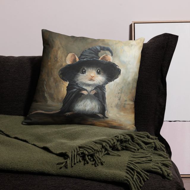 Mouse Wizard - Pillow featuring a charming fantasy art mouse dressed as a wizard in a detailed hand-painted style, resting on a dark sofa with a green throw blanket.
