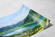 Curved fine art print showing a vibrant landscape with lush green forests, a winding river, and snowy mountain peaks by an Austrian artist in the Zell am See (Print) collection.