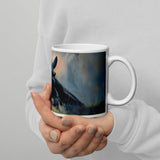 Toothless - Mug by Aronja-Art, white ceramic mug with cute blue and teal dragon artwork, held in hands